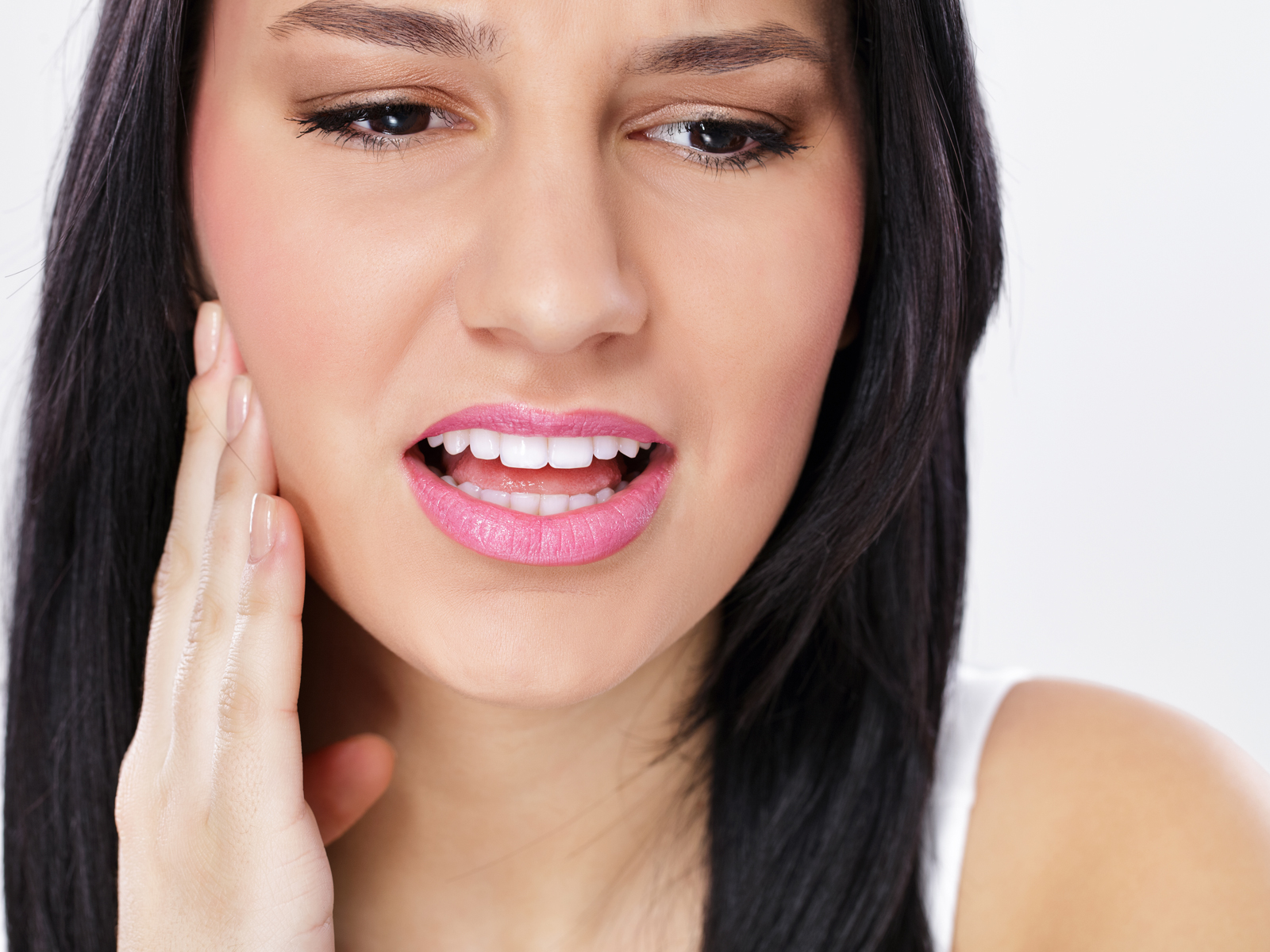 Why does my dental implant hurt when I chew